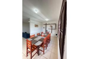 a dining room with a table and chairs at casa brisa do mar in Aquiraz
