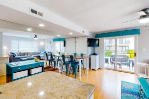 a living room with a couch and a table at Outrigger 114 in Ocean City