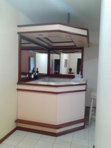 a mirror on top of a counter in a room at Hotel Pecato in Santa Rosa
