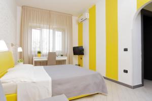 Postel nebo postele na pokoji v ubytování Guest House Le Tre Isole Sorrento