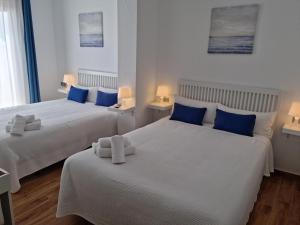 Postel nebo postele na pokoji v ubytování Hostal Nerjasol