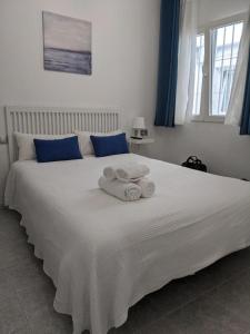 Postel nebo postele na pokoji v ubytování Hostal Nerjasol