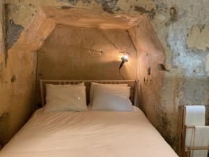 Postel nebo postele na pokoji v ubytování Tesi Eco-suite in Mergelgrot