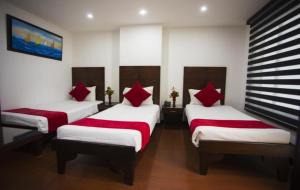 Voodi või voodid majutusasutuse Hotel Bogotá Real toas