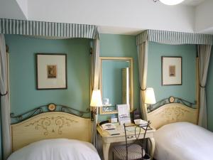 Postel nebo postele na pokoji v ubytování Hotel Monterey Lasoeur Ginza