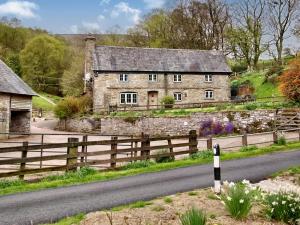 an old stone house on the side of a road at The Birches in Craswall