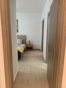 Postel nebo postele na pokoji v ubytování KOS SUITE HOME