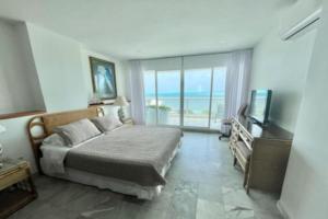 Μια τηλεόραση ή/και κέντρο ψυχαγωγίας στο Apartamento en Sun Rise San Andrés