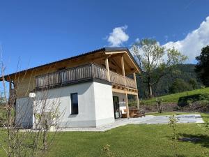 a house with a balcony on top of it at Chalet Alpenzauber, Inzell in Inzell