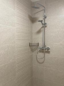 a shower with a glass door in a bathroom at Cosy 2 Bedroom Cottage in Laconnell