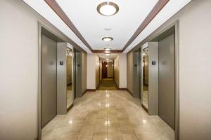a hallway of an office building with a ceiling at PlanURstay - 310 Burnhamthorpe Road West in Mississauga