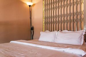 Llit o llits en una habitació de Muiphang De Ville