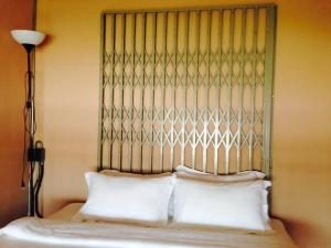 Voodi või voodid majutusasutuse Muiphang De Ville toas