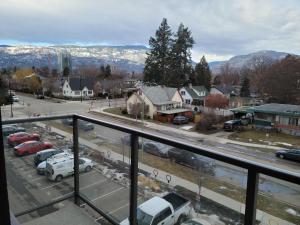 a view of a parking lot from a balcony at Cozy Studio Suite, 15min walk to downtown in Kelowna