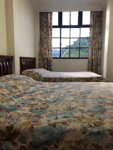 Postel nebo postele na pokoji v ubytování Hotel Chua Gin