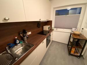 Cucina o angolo cottura di Amrumer Schatztruhe mit Loggia und Meerblick