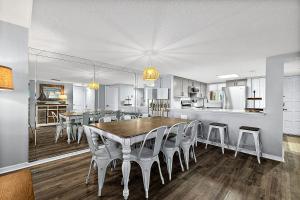 a kitchen and dining room with a table and chairs at Pier Point South 37 in Saint Augustine