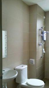 a bathroom with a toilet and a sink at Super Budget 3 Rooms Apartment @ Brinchang Town in Brinchang +4 photos