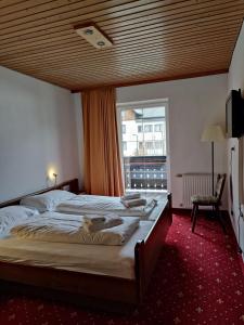Voodi või voodid majutusasutuse Hotel Lindwurm toas