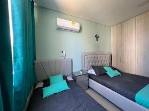 Giường trong phòng chung tại Apartamento Samaria Club Resort +128 ảnh