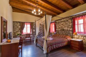 Rúm í herbergi á Itilo Traditional Hotel