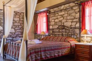 Rúm í herbergi á Itilo Traditional Hotel