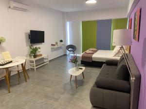 Ένα ή περισσότερα κρεβάτια σε δωμάτιο στο Connect Suites