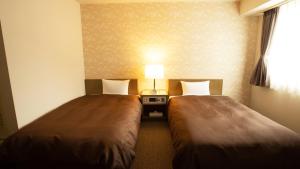 Postel nebo postele na pokoji v ubytování Hotel Yassa