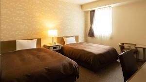 Postel nebo postele na pokoji v ubytování Hotel Yassa