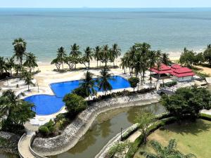 an aerial view of a resort with a swimming pool at Sunshine Beach Condotel by Lux in Na Jomtien