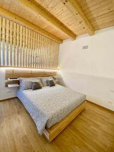 Postel nebo postele na pokoji v ubytování MARCO APARTMENTS di Locanda da Marco