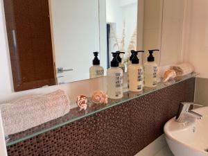 A bathroom at First row to the sea - Nautilus Deluxe Apartment