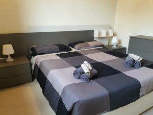 A bed or beds in a room at Villa Joana