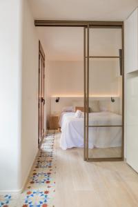 Krevet ili kreveti u jedinici u okviru objekta Pizarro by Seaward Suites