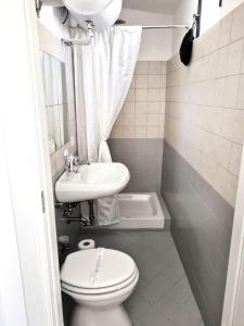 a small bathroom with a toilet and a sink at Apartment 1913 in Ponticelli +19 photos