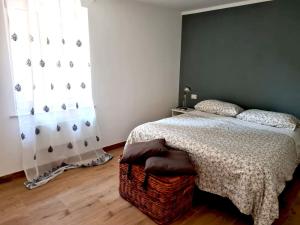 a bedroom with a bed and a window at Apartment 1913 in Ponticelli