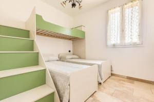 Ein Bett oder Betten in einem Zimmer der Unterkunft Salentoandmore - Villa La Macchia