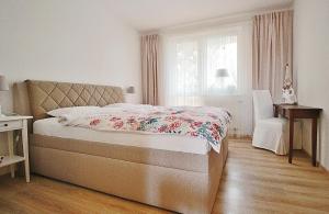 Кровать или кровати в номере Jediný apartmán Tatranská Štrba