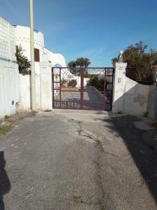 a gate to a house with a driveway at Villa Anna Maria in Polignano a Mare
