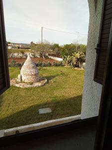 a view of a yard from a window at Villa Anna Maria in Polignano a Mare