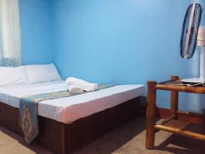 Postel nebo postele na pokoji v ubytování JayDin Travellers Inn