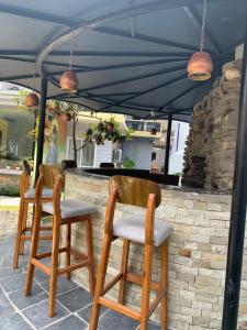 a couple of chairs under an umbrella at Hotel ABC, Boutique Hotel in Pokhara in Pokhara