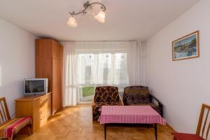 Telewizja i/lub zestaw kina domowego w obiekcie Rooms in the center