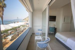 a hotel room with a view of the ocean at VistAmare Luxury Retreat Appartamenti in Sestri Levante