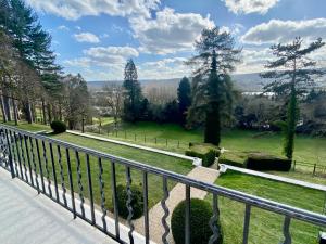a view of a garden from a balcony at Domaine du Chesney in Pressagny l'Orgueilleux