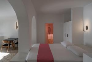 Letto o letti in una camera di Asha Luxury Suites