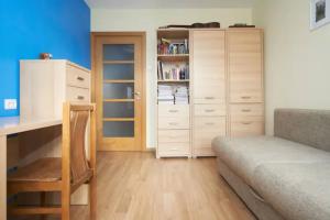 a bedroom with a desk and a bed and a dresser at Cozy private room in a three room apartment Free parking Feel like at home in Vilnius
