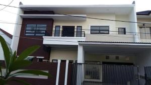 a house with a fence in front of it at New 3br The Green Home in Kepiting-kidul
