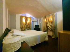 Postel nebo postele na pokoji v ubytování Hotel Le Focette