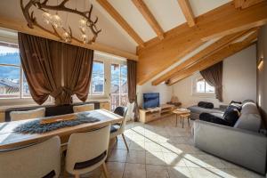 TV a/nebo společenská místnost v ubytování Attico Faloria Luxury